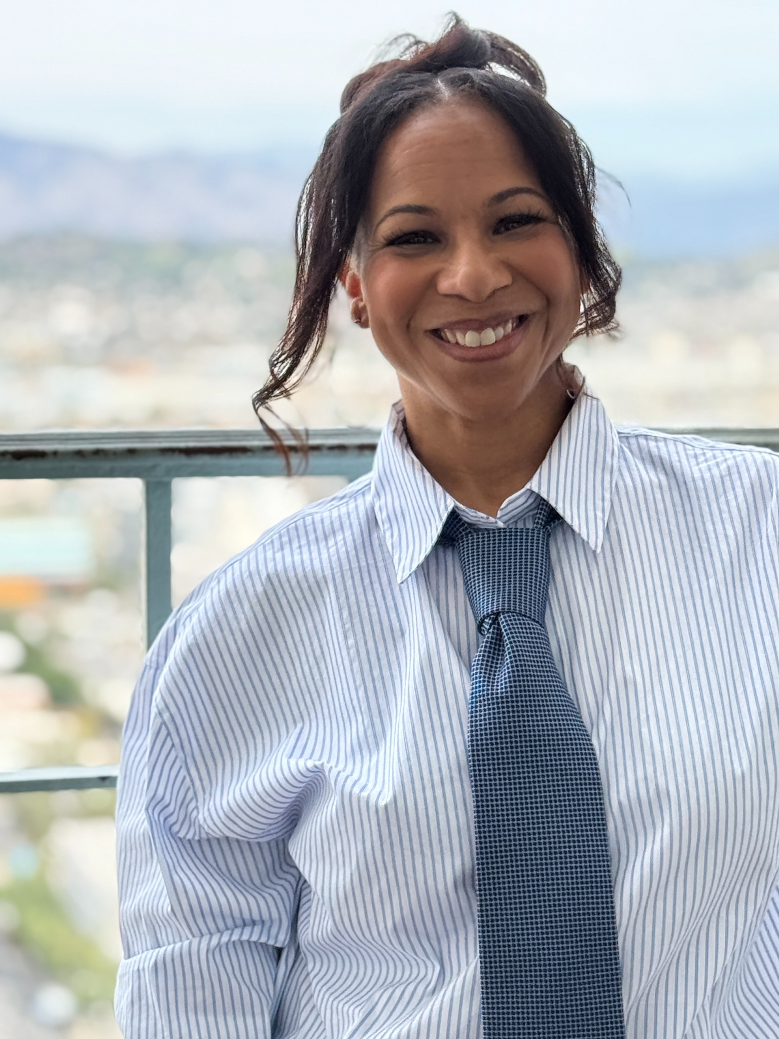 Jill Munroe portrait in a striped shirt and tie
